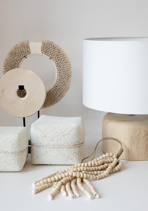 White Marble Disc on Black Metal Stand.