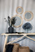 black marble disc on metal stand
